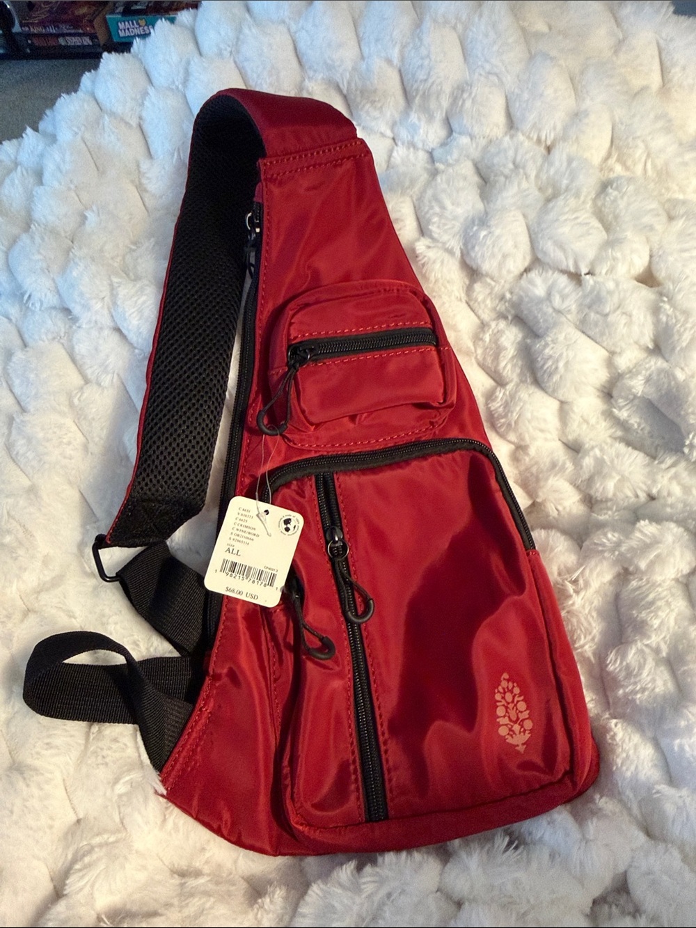 Free People Sling Bag with Multiple Zip Pockets and Adjustable Strap